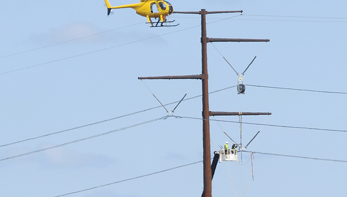 helicopter inspecting power lines