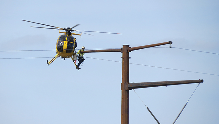 helicopter inspecting power lines
