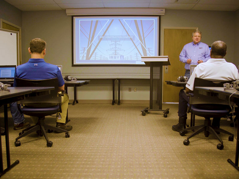 Irby Construction company giving a presentation in an office